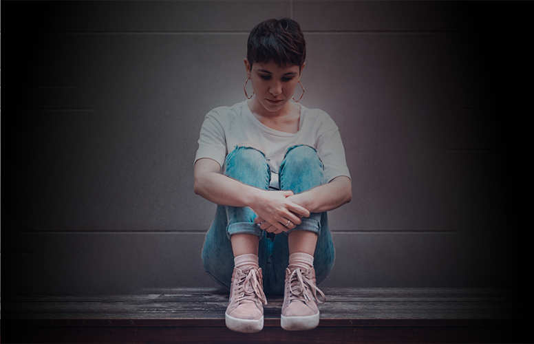 Photo of sad woman sitting on bench